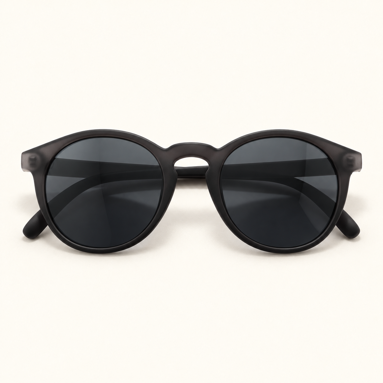 AI-generated illustration of Sunski Dipsea sunglasses in Black Slate, with a charcoal round frame, keyhole bridge and grey lenses.
